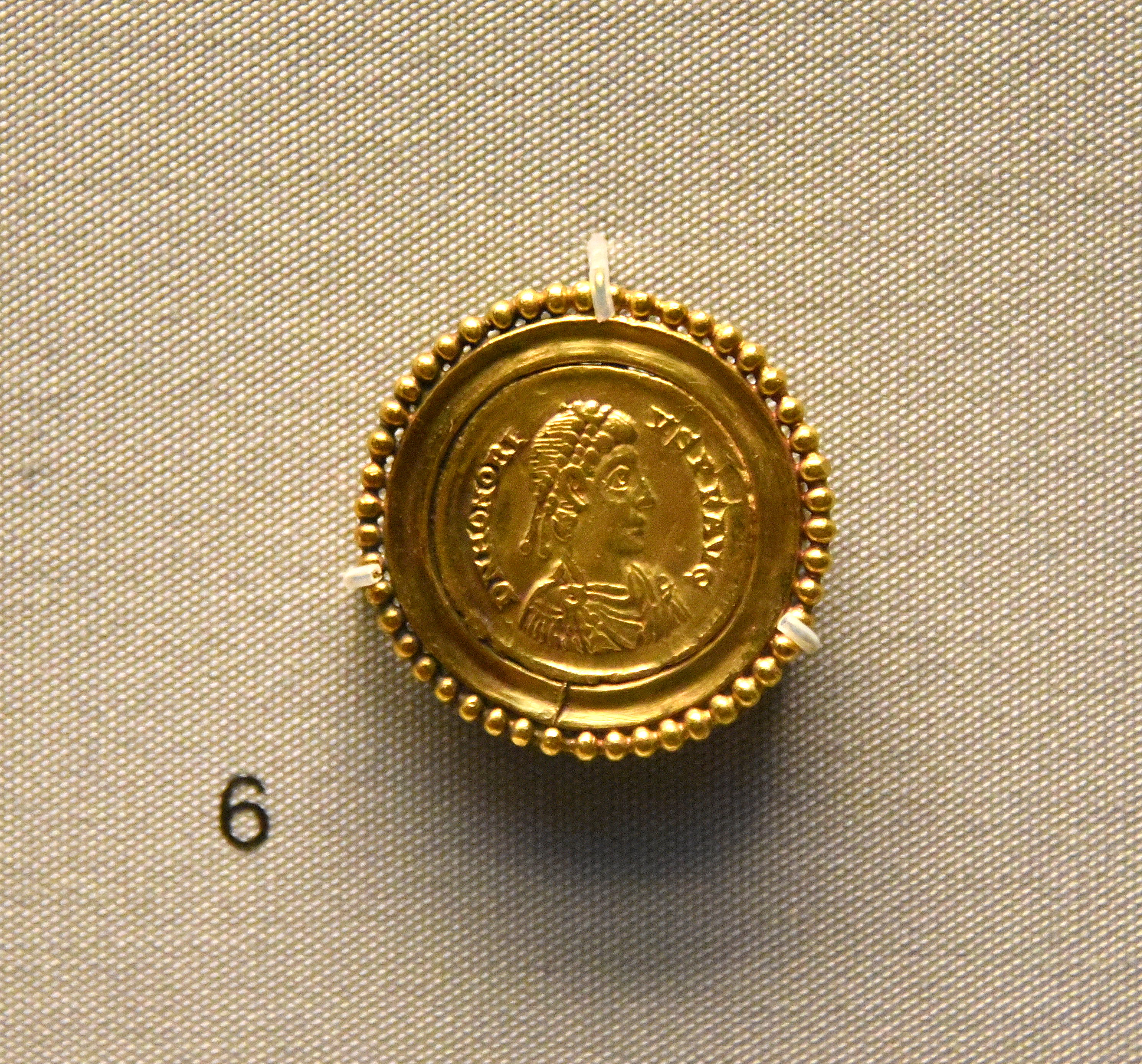 Brooch with Coin of Emperor Honorius Illustration World