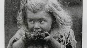 Young Girl Eating War Bread