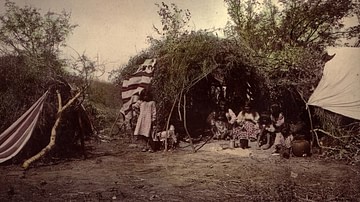 Chiricahua-Apache Medicine Man in Traditional Wickiup with Family, 1883