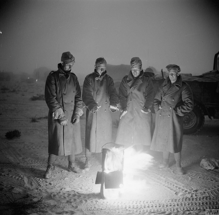 Soldiers Keeping Warm in the Desert Night