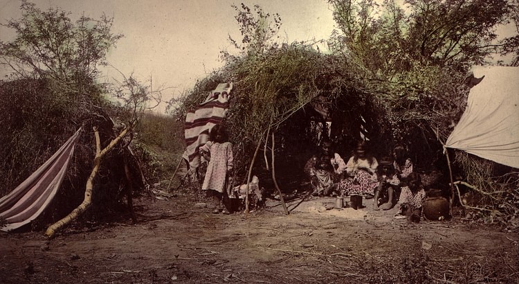 Chiricahua-Apache Medicine Man in Traditional Wickiup with Family, 1883